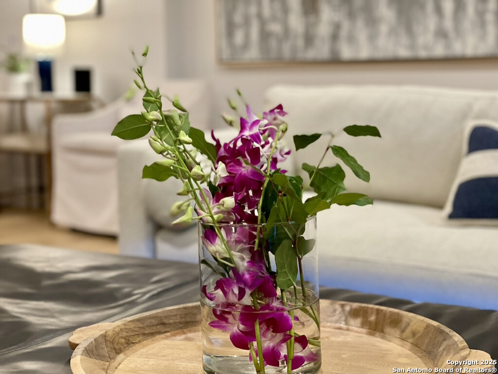 8900 Point W Drive Austin, TX 78759 - Photo 2 of 29 a vase of flowers sitting on a table
