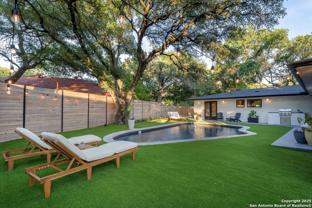 8900 Point W Drive Austin, TX 78759 - Photo 21 of 29 a view of a backyard with a patio and fire pit