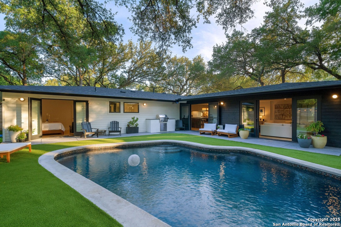 8900 Point W Drive Austin, TX 78759 - Photo 22 of 29 view of a house with swimming pool and a yard