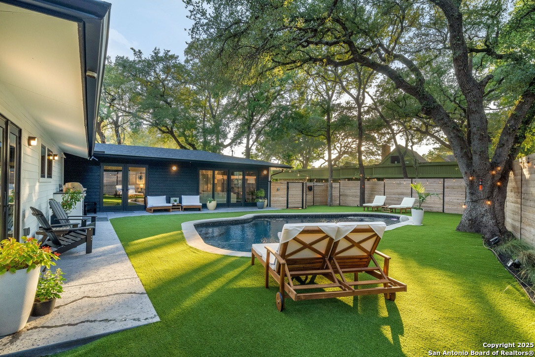 8900 Point W Drive Austin, TX 78759 - Photo 23 of 29 a view of a swimming pool with a patio