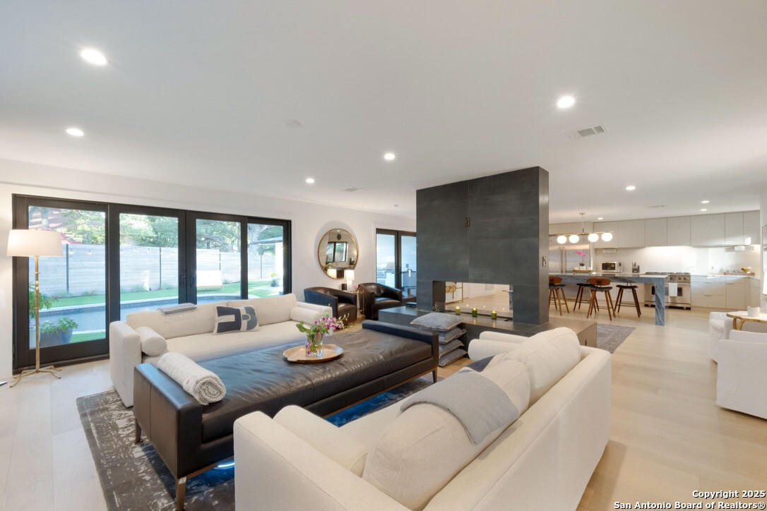 8900 Point W Drive Austin, TX 78759 - Photo 4 of 29 a living room with furniture and a large window