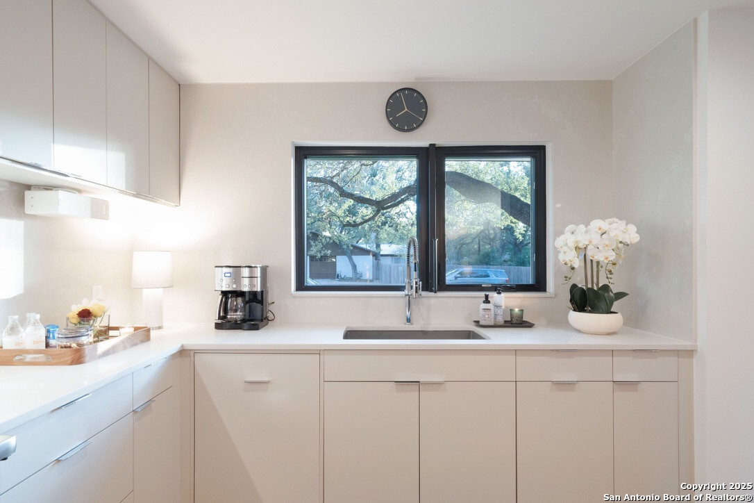 8900 Point W Drive Austin, TX 78759 - Photo 7 of 29 a bathroom with a sink and a large window