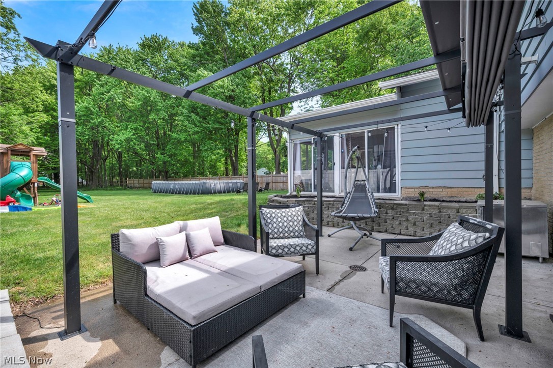 12956 Huffman Road Parma, OH 44130 - Photo 39 of 49 View of patio featuring a playground and area for grilling