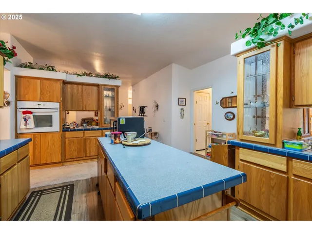 a kitchen that has a lot of cabinets in it