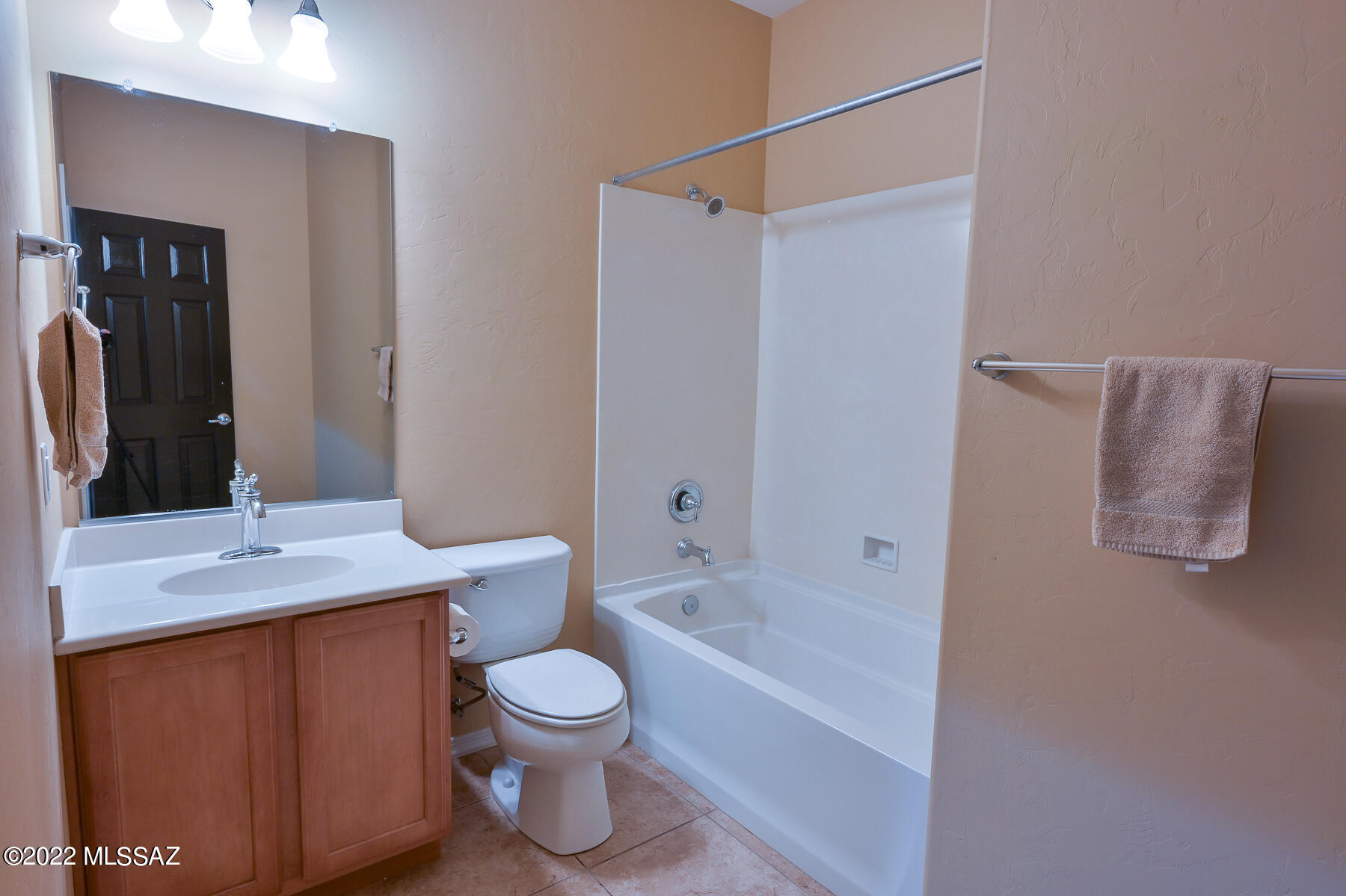 10804 East Salsabila Road Tucson, AZ 85747 - Photo 14 of 50 a bathroom with a granite countertop sink toilet and shower