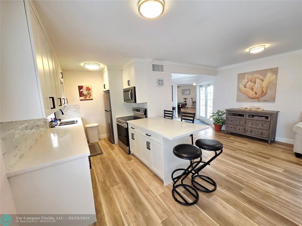 2230 Northeast 56th Place, Unit 208 Fort Lauderdale, FL 33308 - Photo 20 of 23 Kitchen facility, renovated