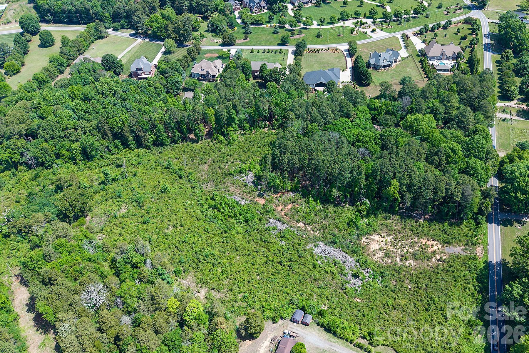13745 Ramah Church Road Huntersville, NC 28078 - Photo 6 of 17 an aerial view of residential house with outdoor space and trees all around