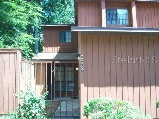 5734 Southwest 8th Place Gainesville, FL 32607 - Photo 1 of 10 a potted plant sitting in front of a window