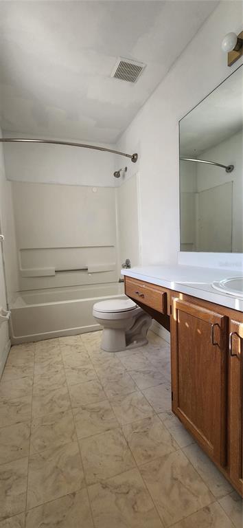 5734 Southwest 8th Place Gainesville, FL 32607 - Photo 13 of 18 a bathroom with a sink and a vanity