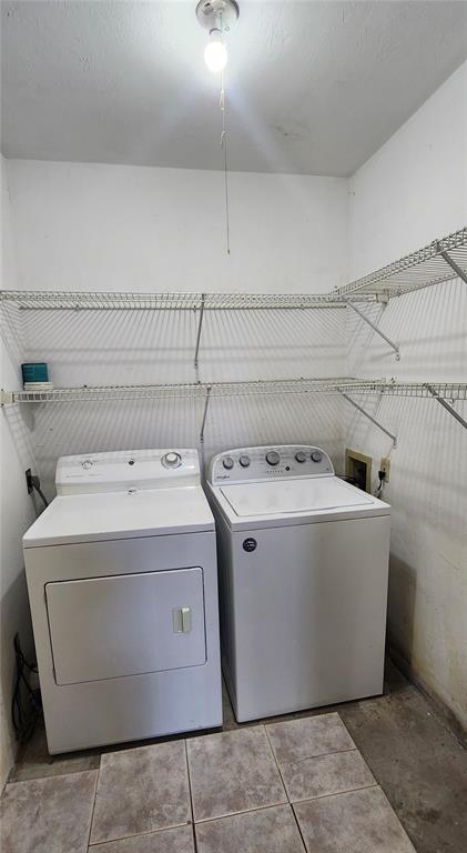 5734 Southwest 8th Place Gainesville, FL 32607 - Photo 16 of 18 a utility room with dryer and washer
