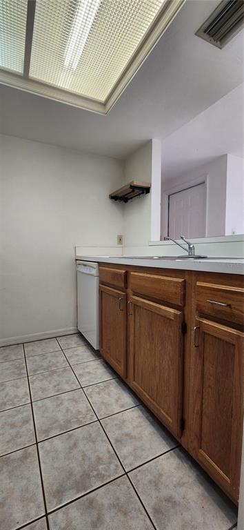 5734 Southwest 8th Place Gainesville, FL 32607 - Photo 3 of 18 a kitchen with a sink and cabinets