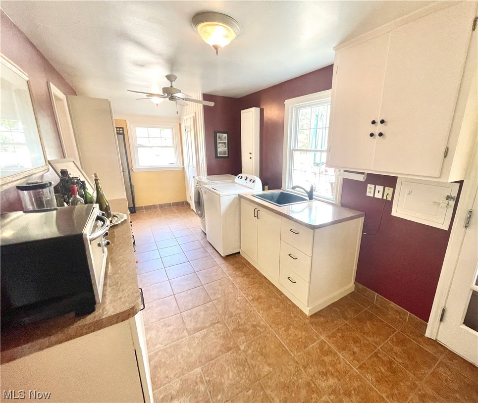 1507 Clubside Road Lyndhurst, OH 44124 - Photo 16 of 32 featuring separate washer and dryer, ceiling fan, and light tile floors