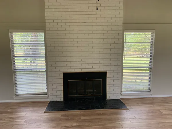 a living room with a fireplace and a floor