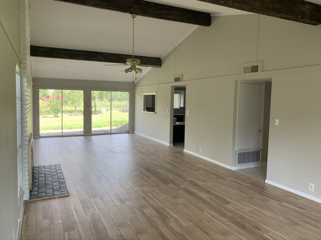 29229 Sheffield Road Waller, TX 77484 - Photo 6 of 16 On the back side of the living room there is two sliding glass doors that bring in AMPLE amounts of natural light.