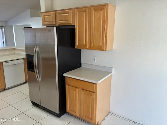 a kitchen with stainless steel appliances a refrigerator and a stove