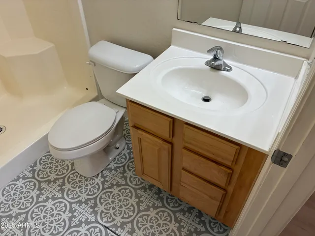 a bathroom with a sink and a toilet
