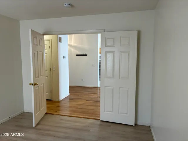 wooden floor with white walls
