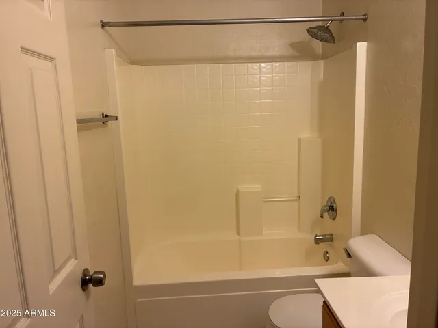 a bathroom with a shower and a bath tub