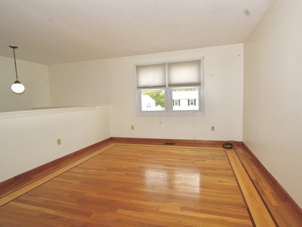8 Timrod Drive Worcester, MA 01603 - Photo 2 of 9 an empty room with a window