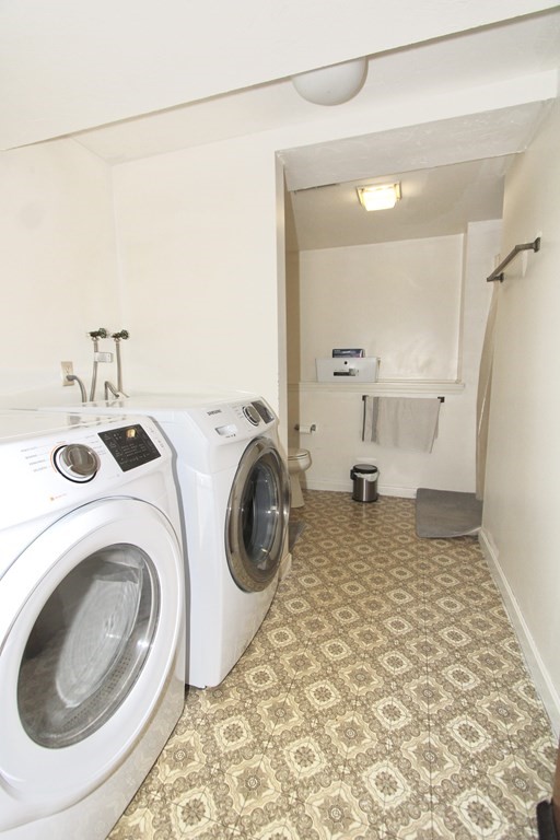 8 Timrod Drive Worcester, MA 01603 - Photo 8 of 9 a bathroom with a sink a washer and dryer