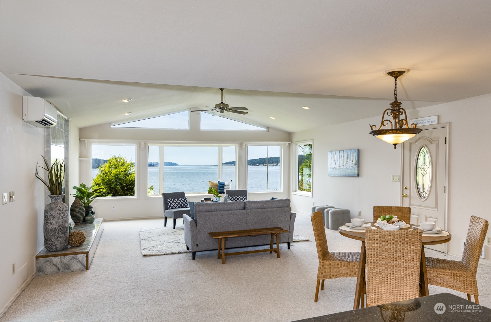 1161 Griffith Point Road Nordland, WA 98358 - Photo 14 of 38 a dining room with furniture and a chandelier