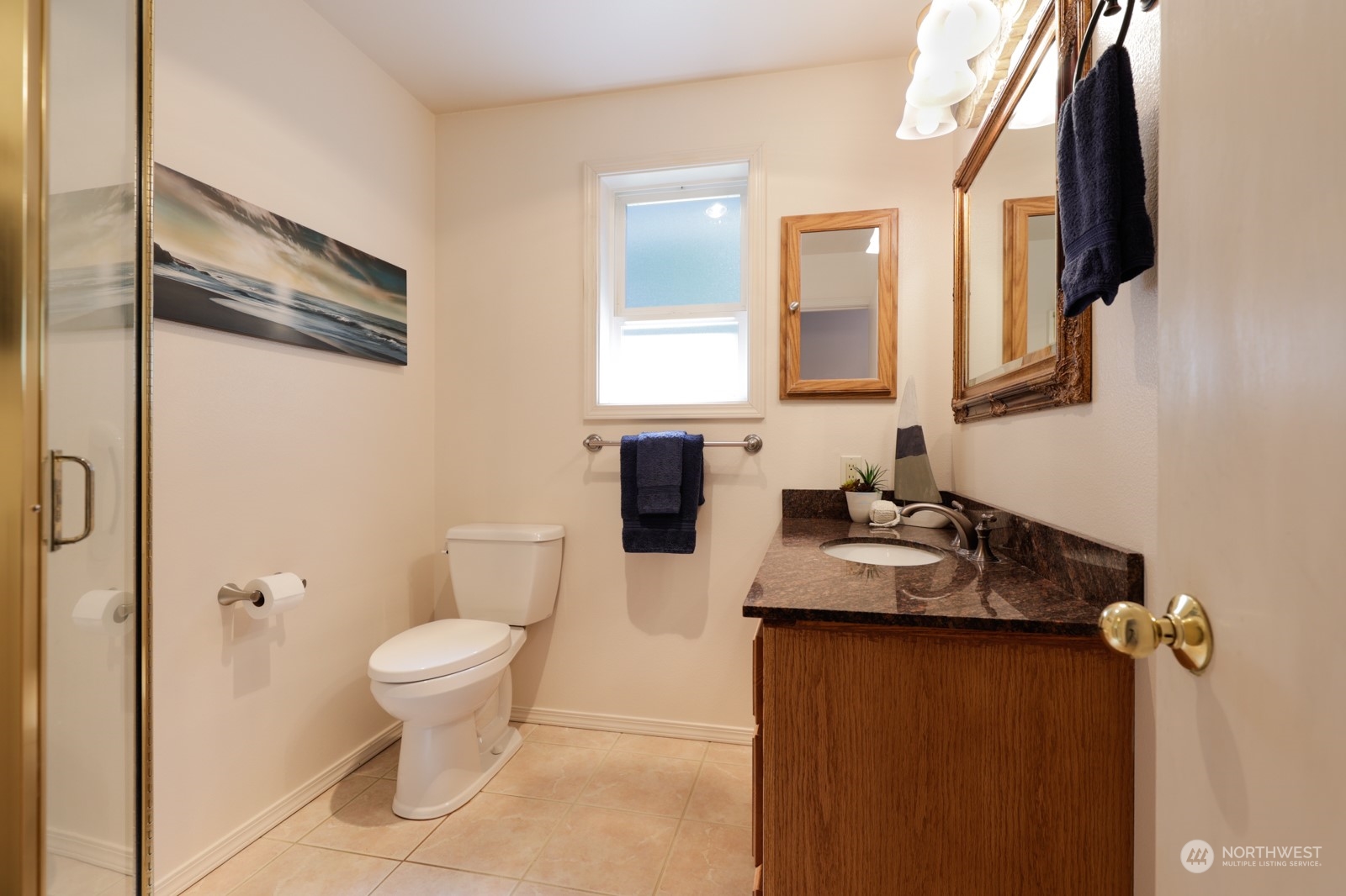 1161 Griffith Point Road Nordland, WA 98358 - Photo 20 of 38 a bathroom with a granite countertop sink toilet and mirror