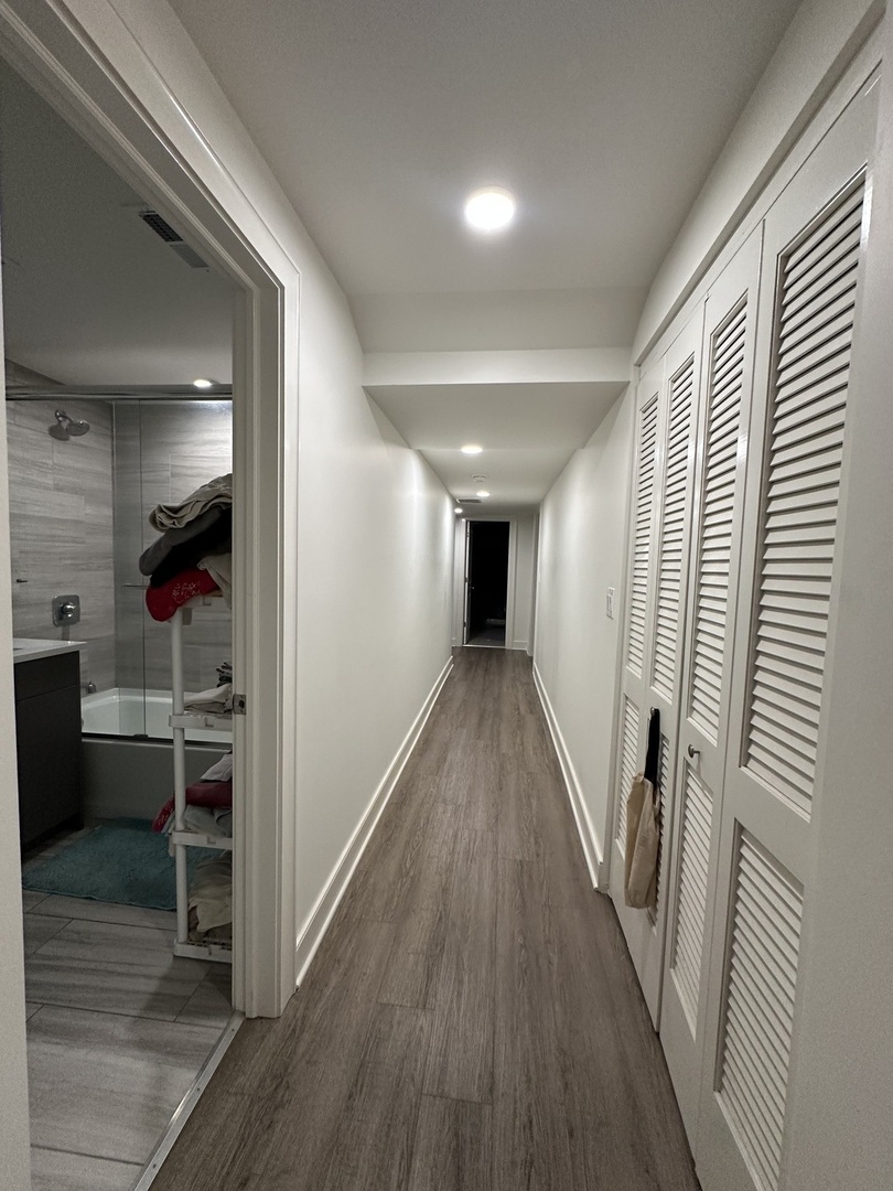 2329 West Monroe Street, Unit LW Chicago, IL 60612 - Photo 14 of 16 a view of a hallway with wooden floor and staircase