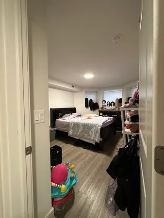 a bedroom with bed and window