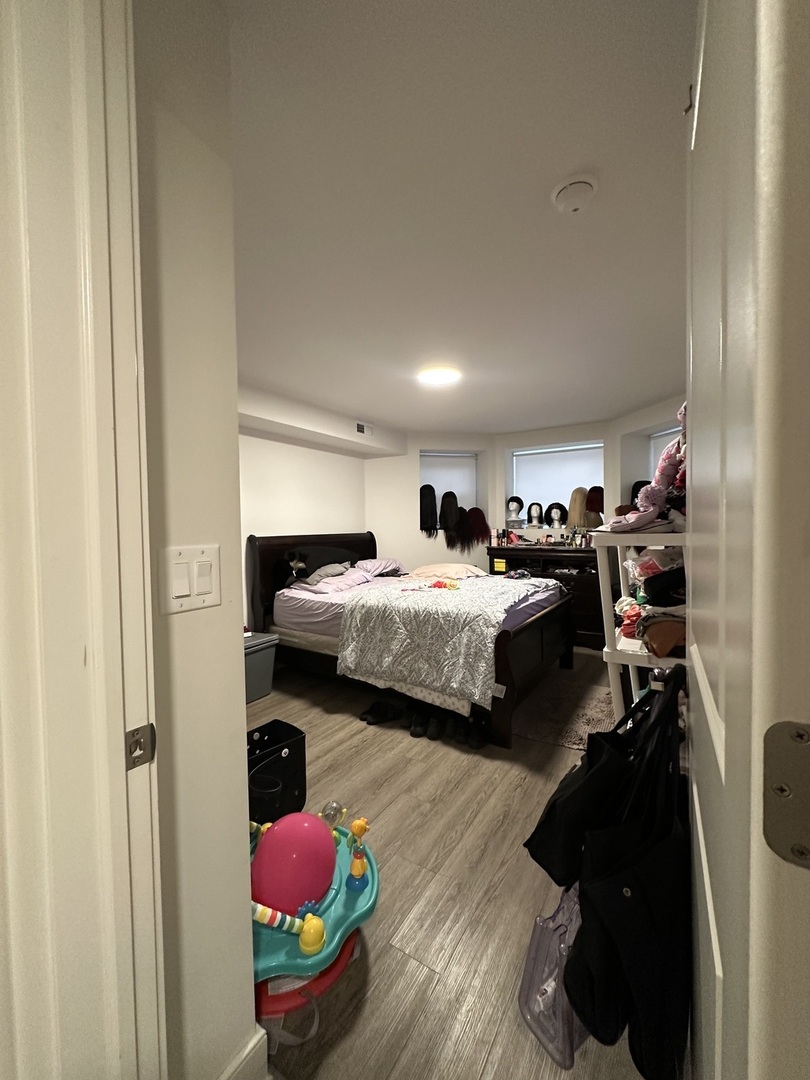 2329 West Monroe Street, Unit LW Chicago, IL 60612 - Photo 8 of 16 a bedroom with bed and window