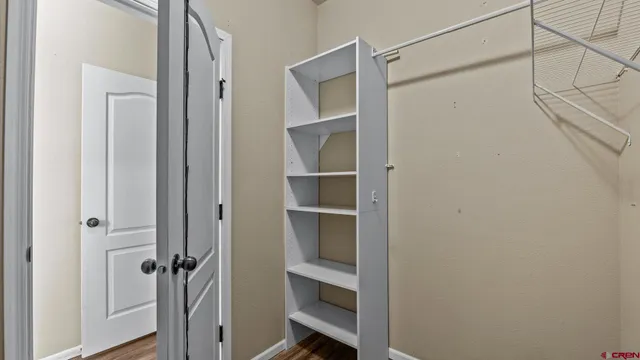 a view of an empty walk in closet