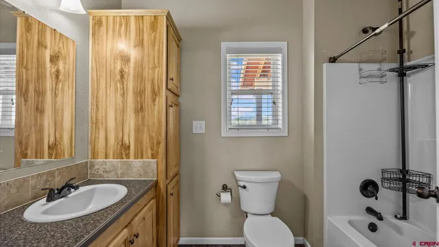 a bathroom with a sink toilet a tub and shower