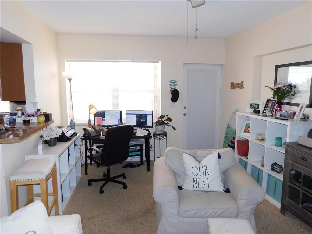 901 South Surf Road, Unit 306 Hollywood, FL 33019 - Photo 14 of 44 a living room with furniture and a flat screen tv