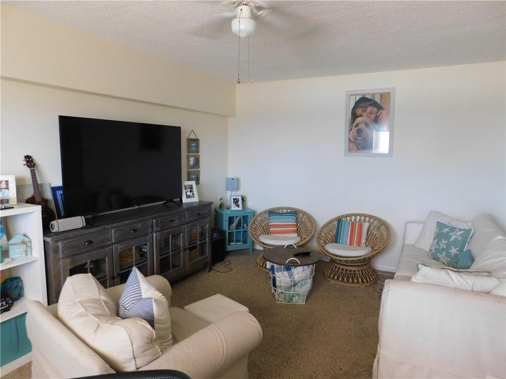 901 South Surf Road, Unit 306 Hollywood, FL 33019 - Photo 17 of 44 a living room with furniture and a flat screen tv