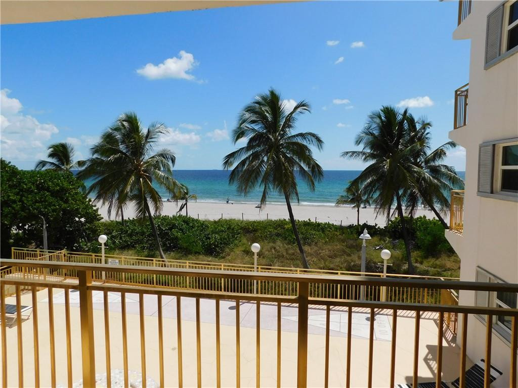 901 South Surf Road, Unit 306 Hollywood, FL 33019 - Photo 2 of 44 a view of outdoor space with palm trees