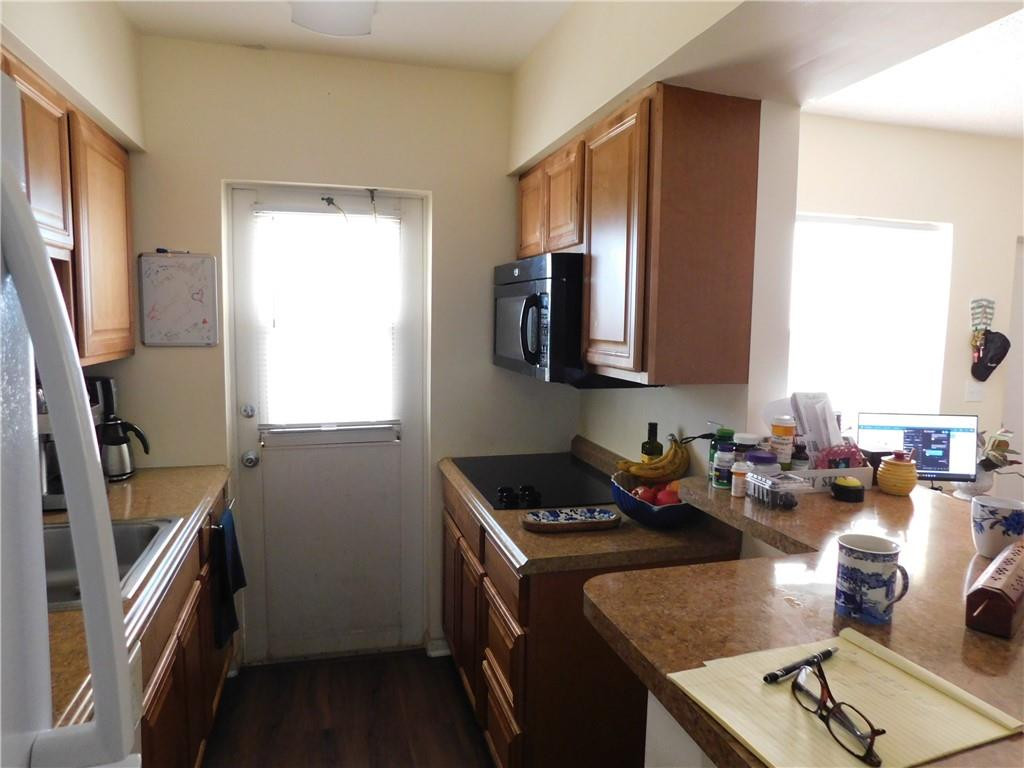 901 South Surf Road, Unit 306 Hollywood, FL 33019 - Photo 23 of 44 a kitchen with sink refrigerator and window