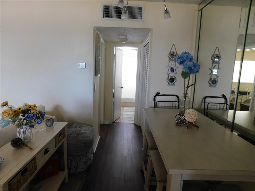 901 South Surf Road, Unit 306 Hollywood, FL 33019 - Photo 24 of 44 a view of a room with a table and chairs