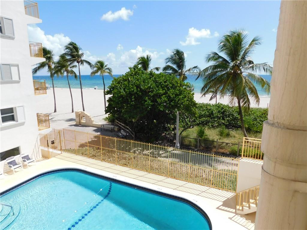 901 South Surf Road, Unit 306 Hollywood, FL 33019 - Photo 3 of 44 a view of a house with a swimming pool