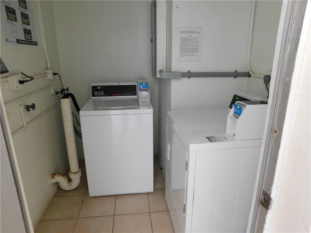 901 South Surf Road, Unit 306 Hollywood, FL 33019 - Photo 32 of 44 a utility room with dryer and washer
