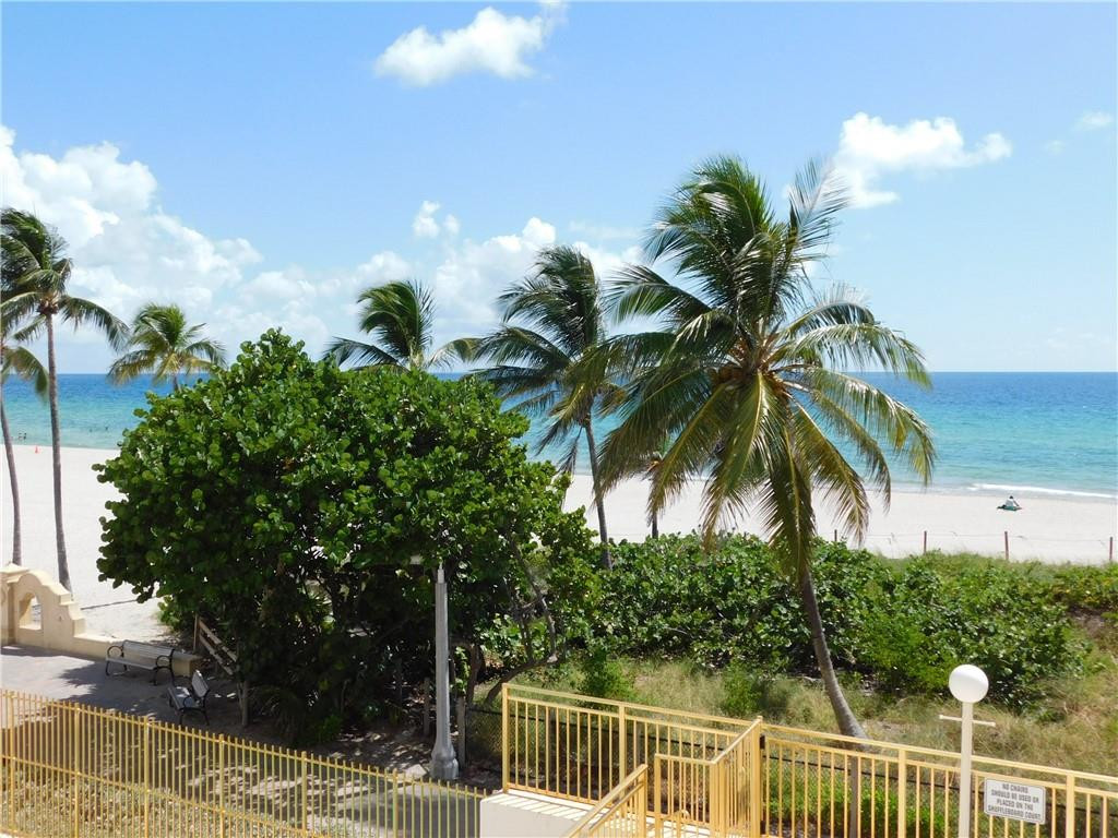 901 South Surf Road, Unit 306 Hollywood, FL 33019 - Photo 34 of 44 a view of a house with a yard and potted plants