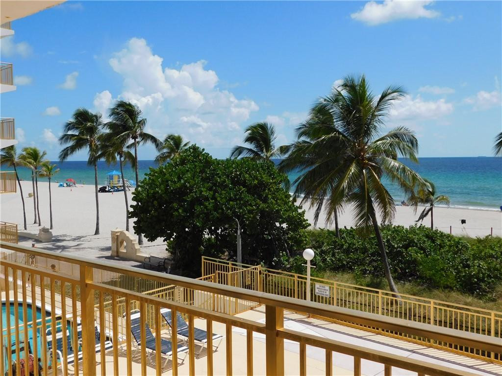 901 South Surf Road, Unit 306 Hollywood, FL 33019 - Photo 35 of 44 a view of a balcony with palm trees