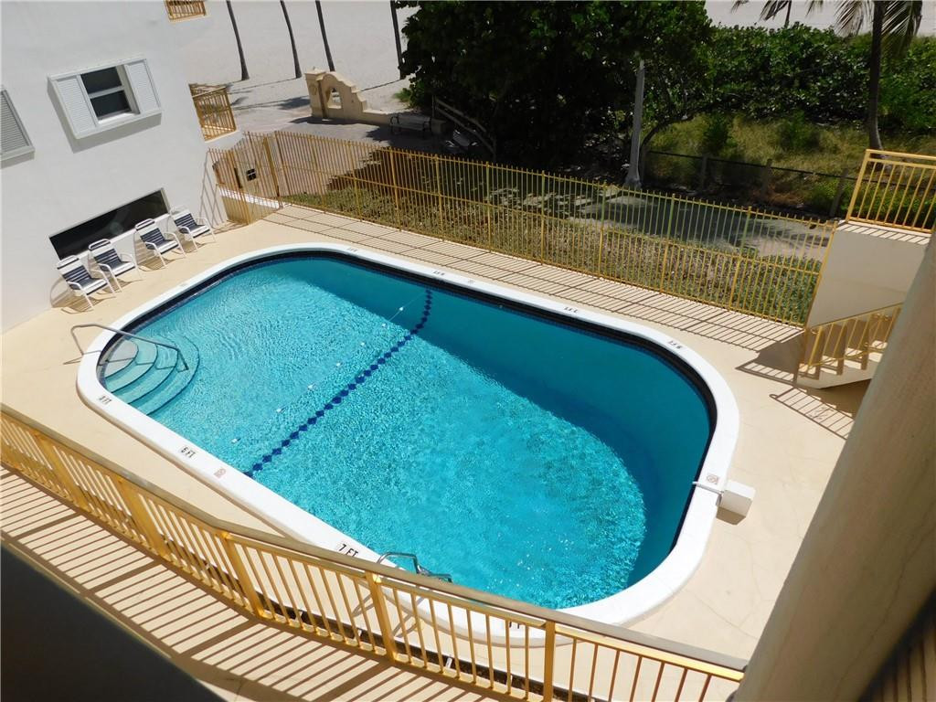 901 South Surf Road, Unit 306 Hollywood, FL 33019 - Photo 37 of 44 a view of a swimming pool with a patio