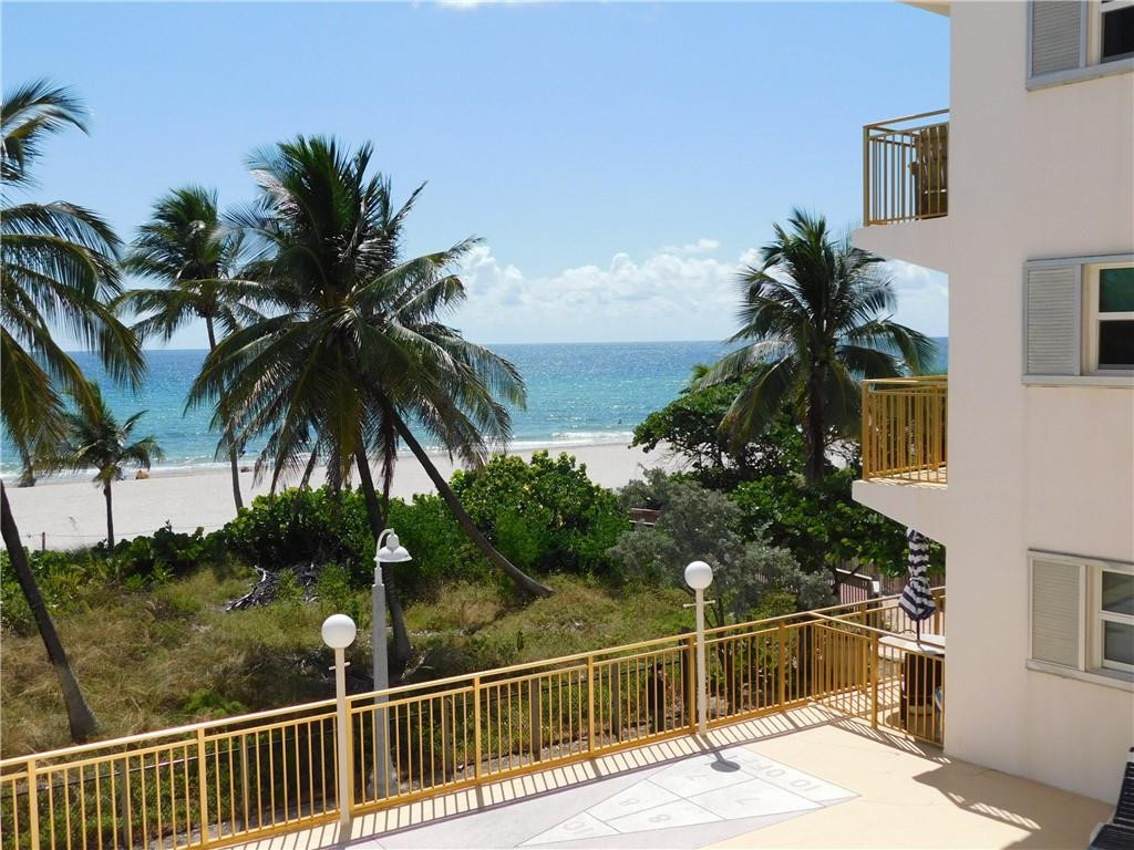 901 South Surf Road, Unit 306 Hollywood, FL 33019 - Photo 4 of 44 a view of a palm plant from a balcony