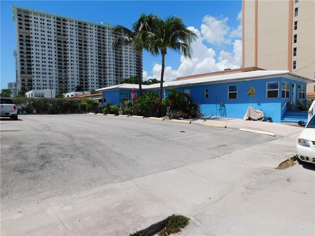 901 South Surf Road, Unit 306 Hollywood, FL 33019 - Photo 41 of 44 a front view of multiple houses with palm trees