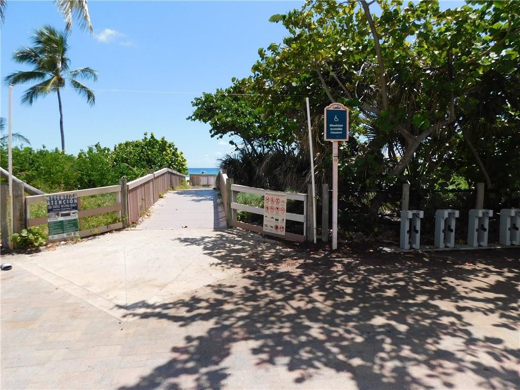 901 South Surf Road, Unit 306 Hollywood, FL 33019 - Photo 8 of 44 a front view of a house with a yard
