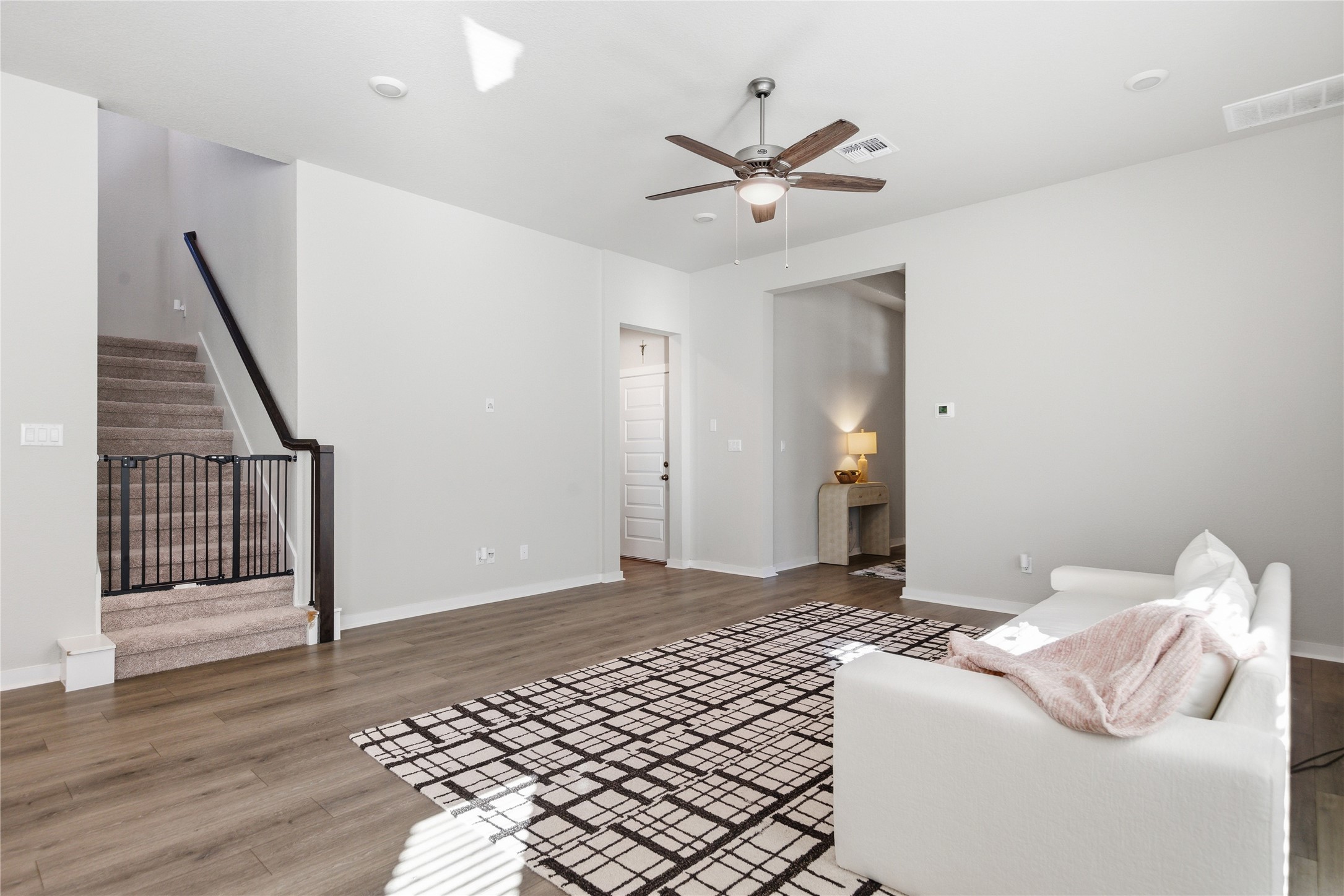 1008 Summer Glen Georgetown, TX 78628 - Photo 23 of 34 a bedroom with a large bed and a chandelier