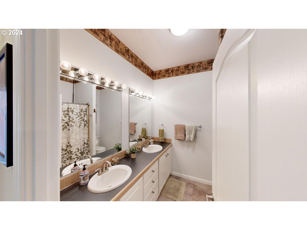 32877 Hillside Acres Road Gold Beach, OR 97444 - Photo 17 of 43 a bathroom with a sink double vanity granite and a mirror
