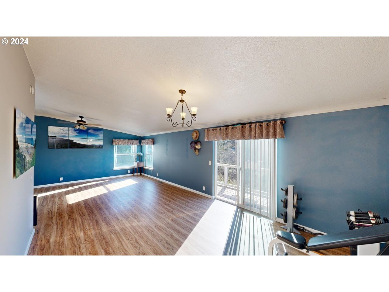 32877 Hillside Acres Road Gold Beach, OR 97444 - Photo 23 of 43 a living room with furniture and a wooden floor