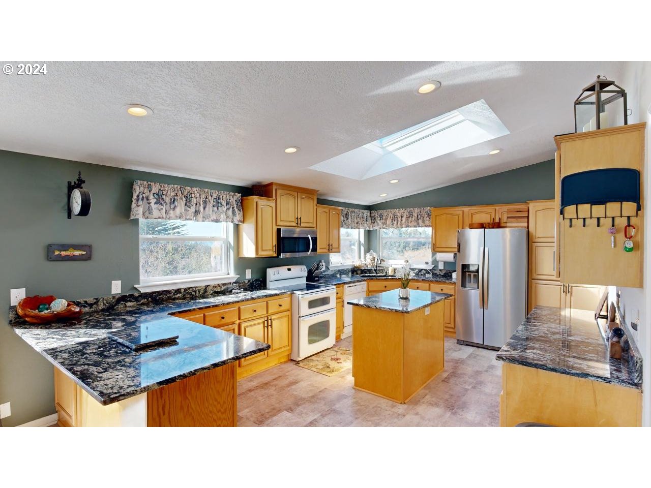 32877 Hillside Acres Road Gold Beach, OR 97444 - Photo 6 of 43 a kitchen with a stove a refrigerator and a sink