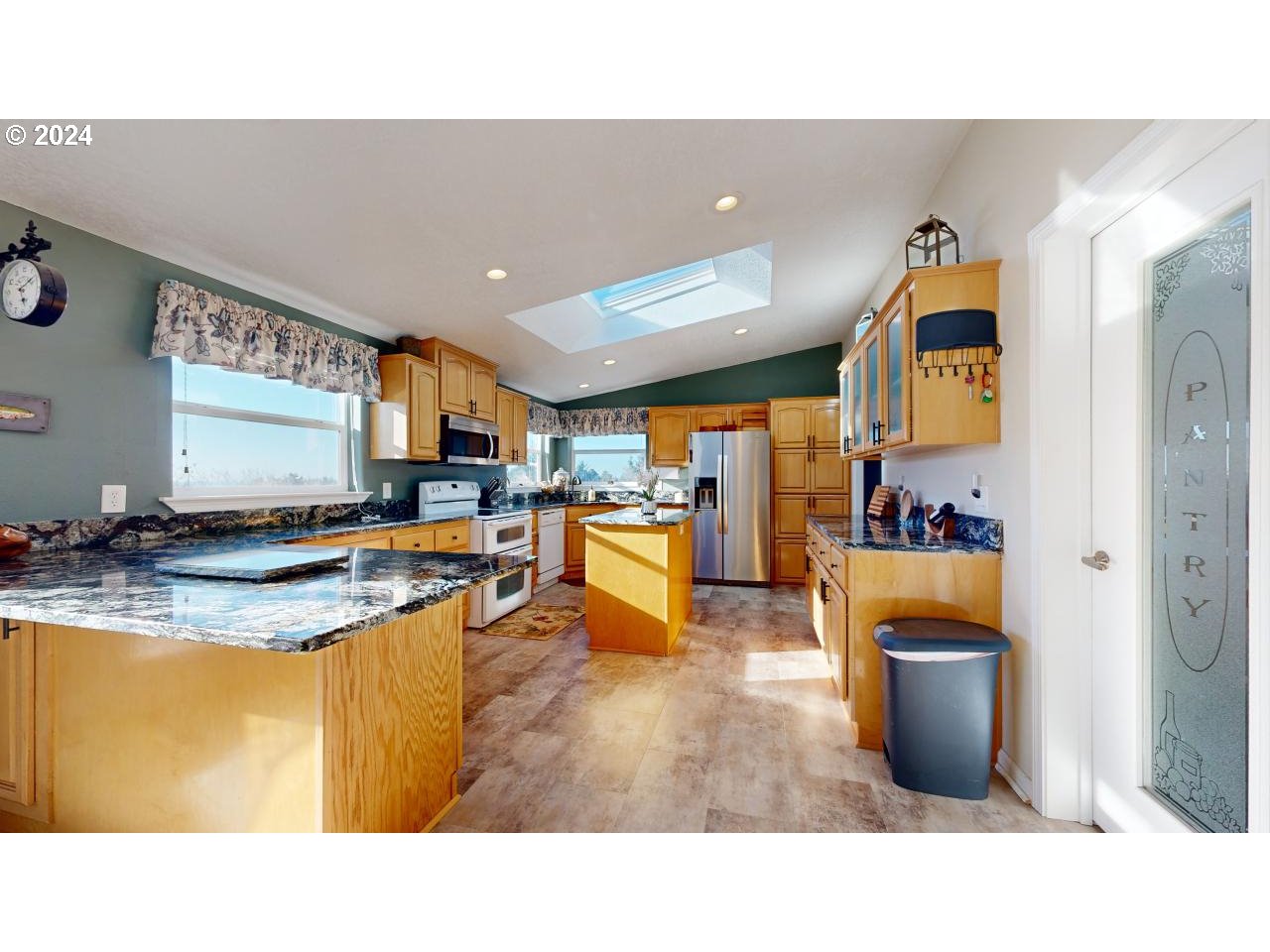 32877 Hillside Acres Road Gold Beach, OR 97444 - Photo 9 of 43 a kitchen with a refrigerator a stove and a sink