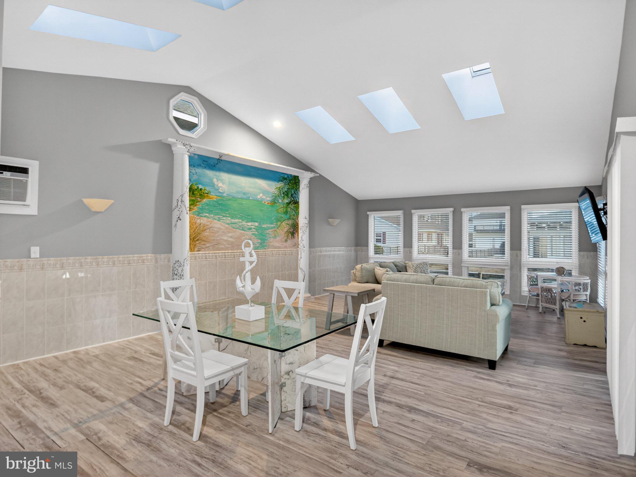 Bright coastal retreat with skylights.